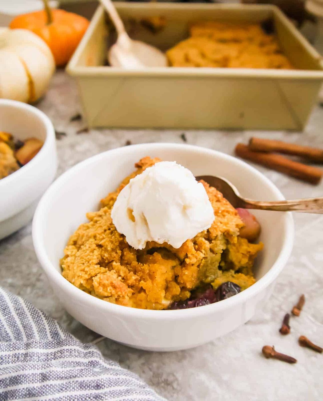 Paleo Blueberry Pear Cobbler with ice-cream on top.