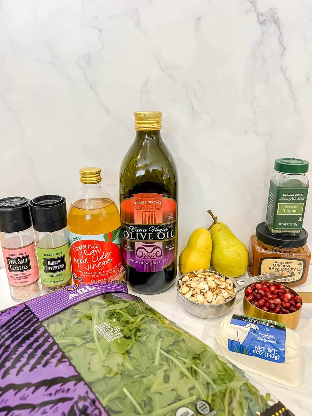 Ingredients needed to make arugula and goat cheese salad.