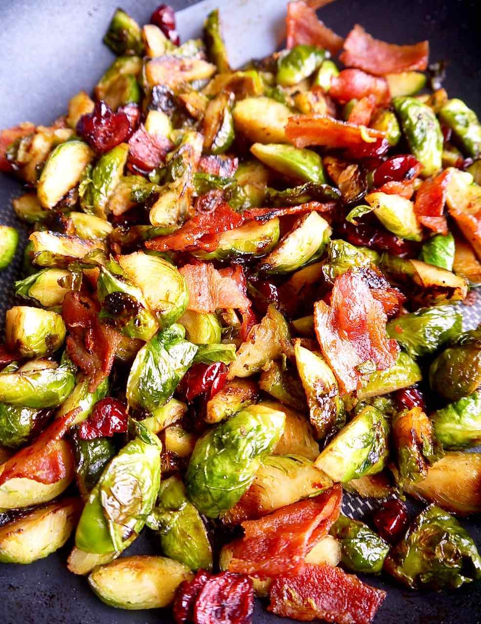 Brussels sprouts, bacon, cranberry filling in a pan.