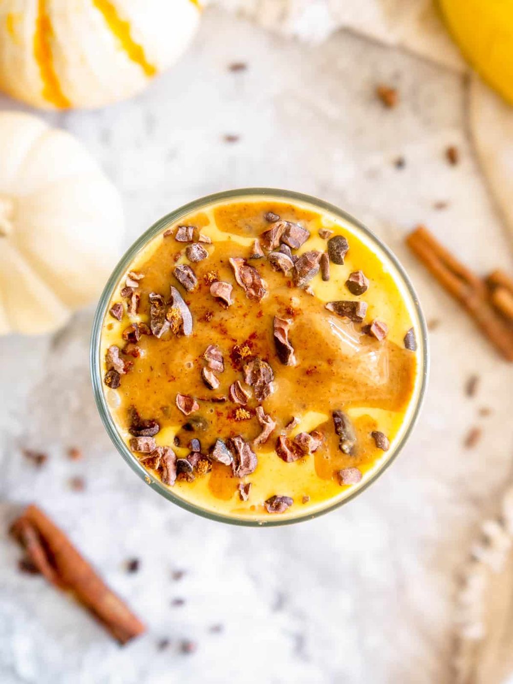 Aerial view of Pumpkin puree smoothie with banana.