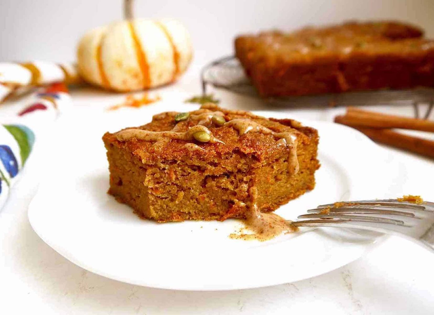 Recipe for pumpkin carrot cake on a plate.