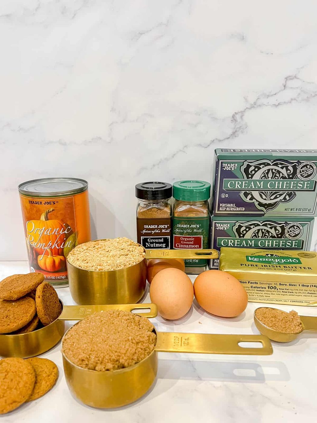 Ingredients needed to make pumpkin cheesecake with gingersnap crust.