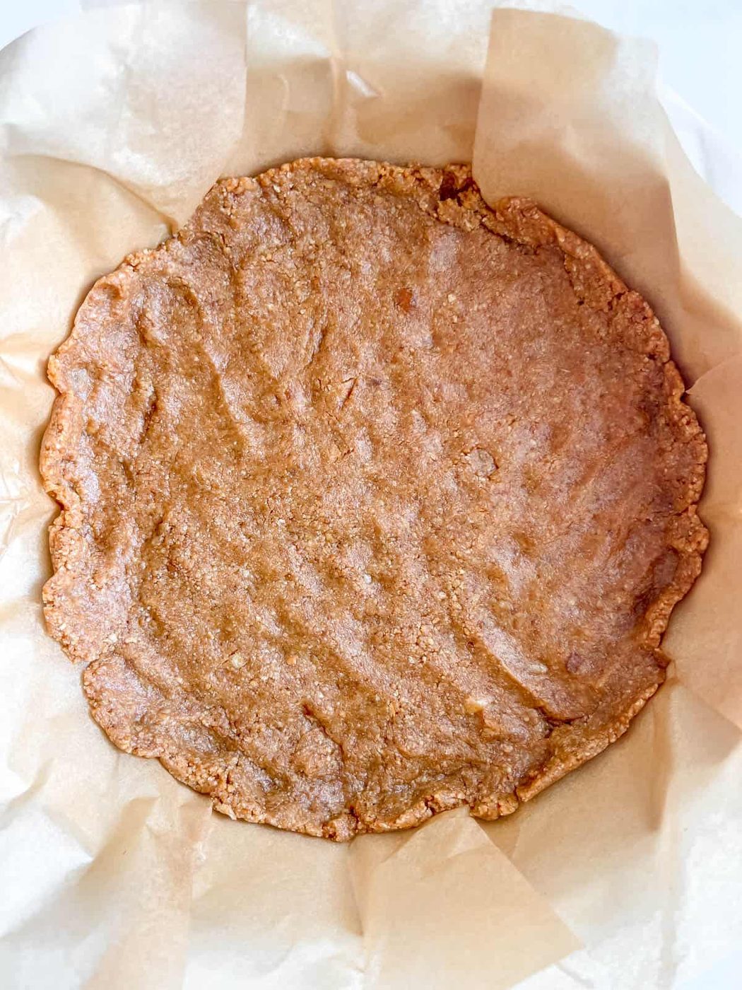 Cheesecake pie crust in pan.