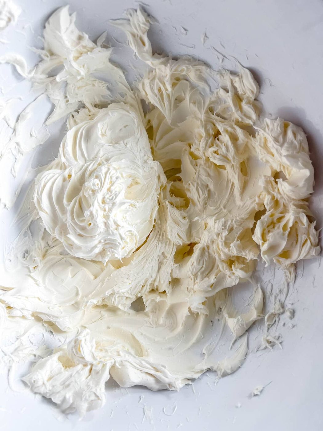 Cream cheese mixed in a bowl.