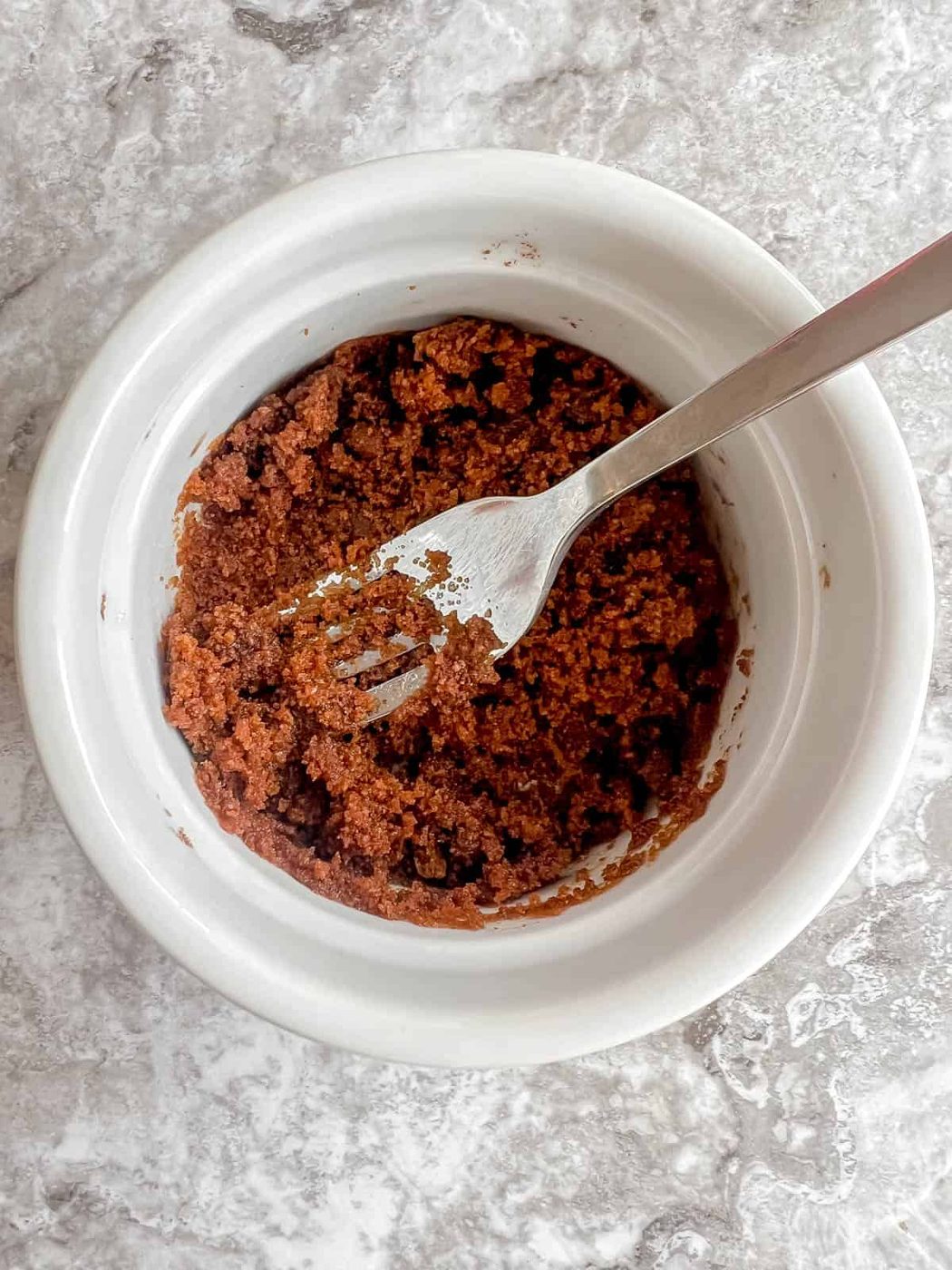 Sugar and oil in a ramekin.