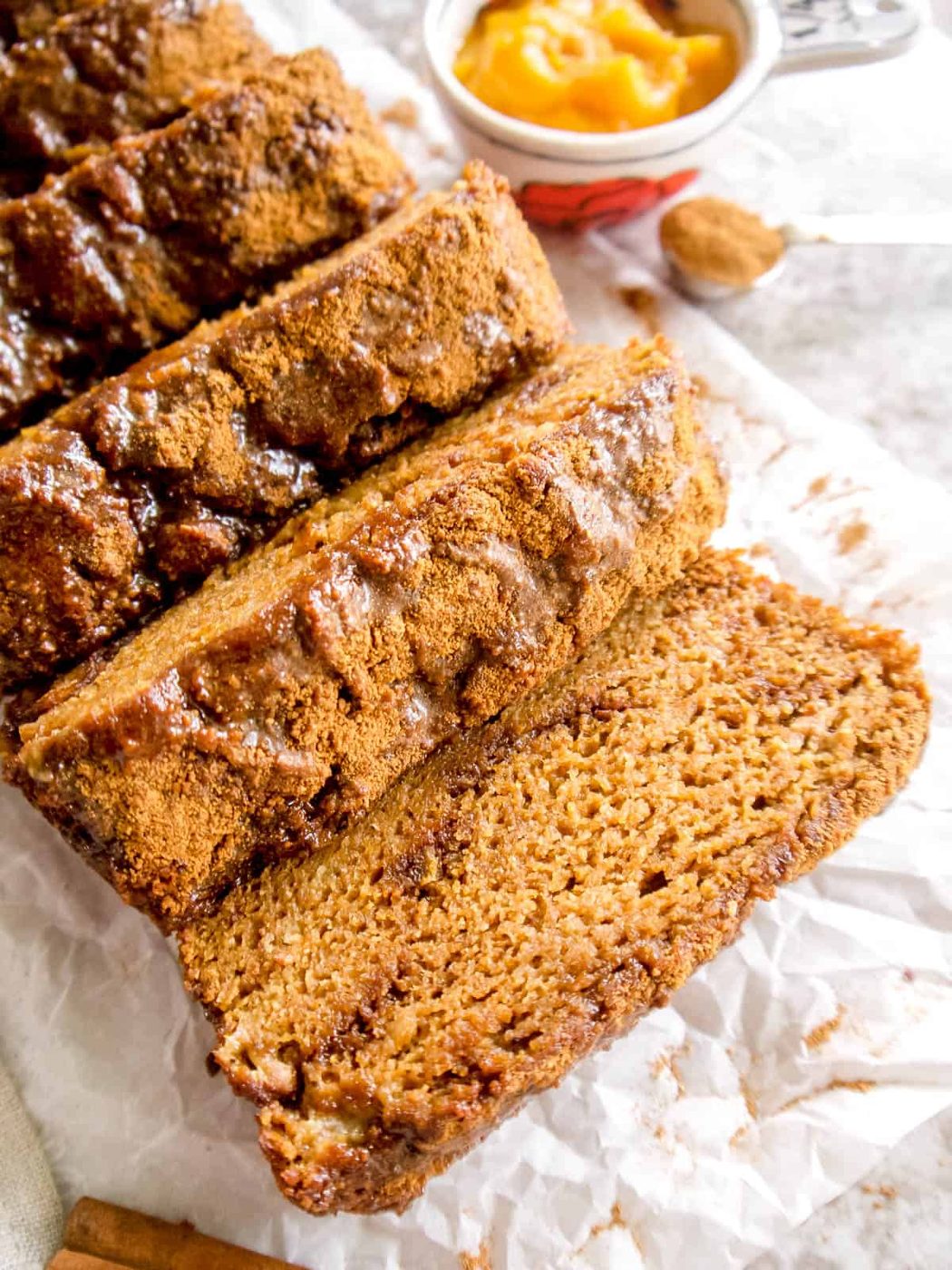 A gluten-free pumpkin banana bread sliced into 8 pieces.