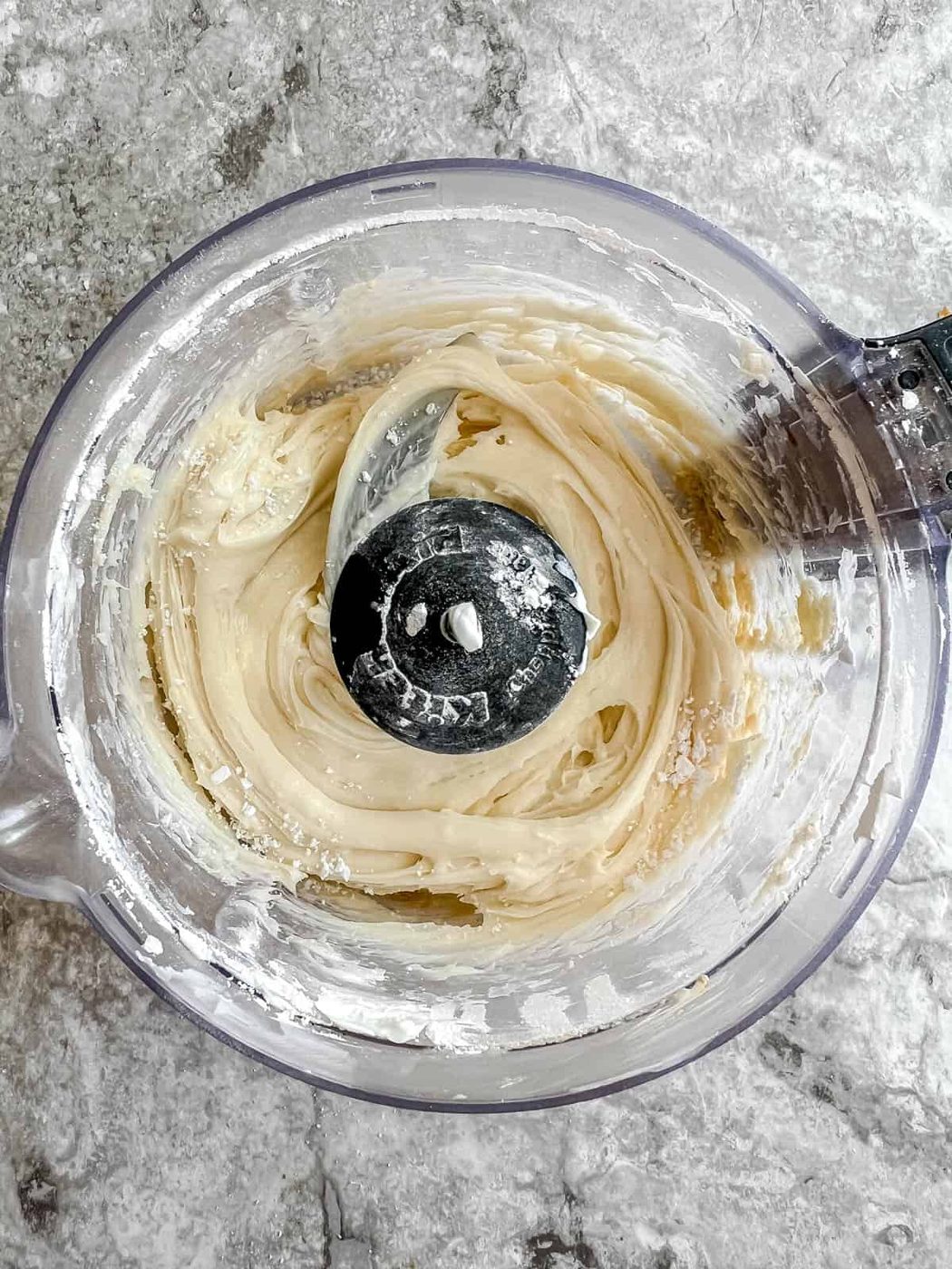 Cream cheese frosting in food processor.