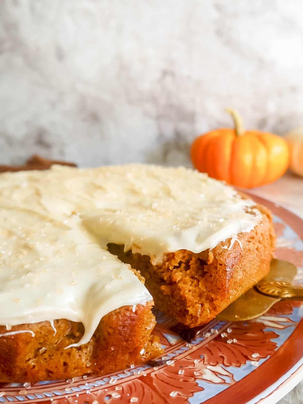 A slice of almond flour pumpkin cake being served.