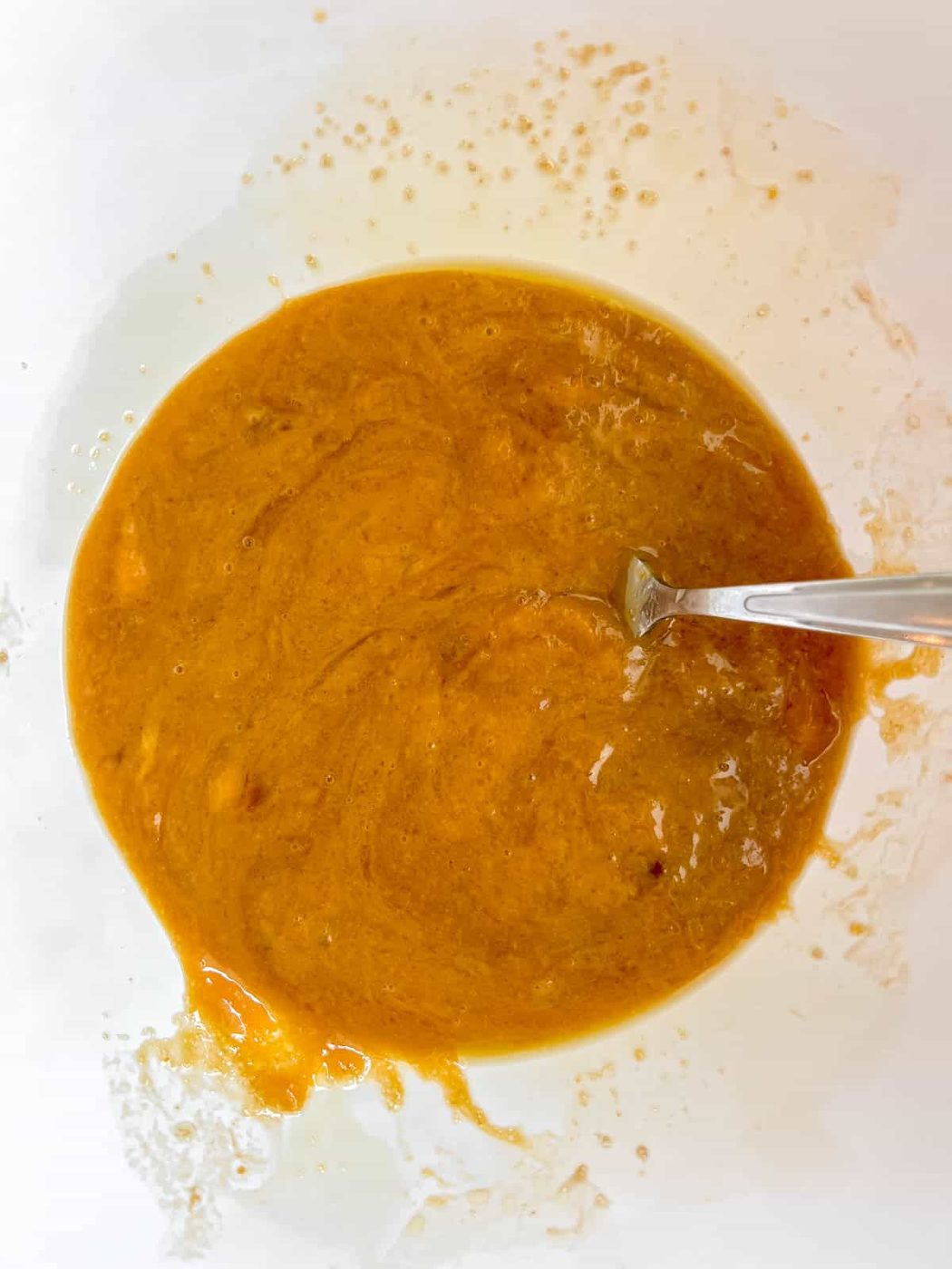 Wet ingredients for pumpkin olive oil cake.