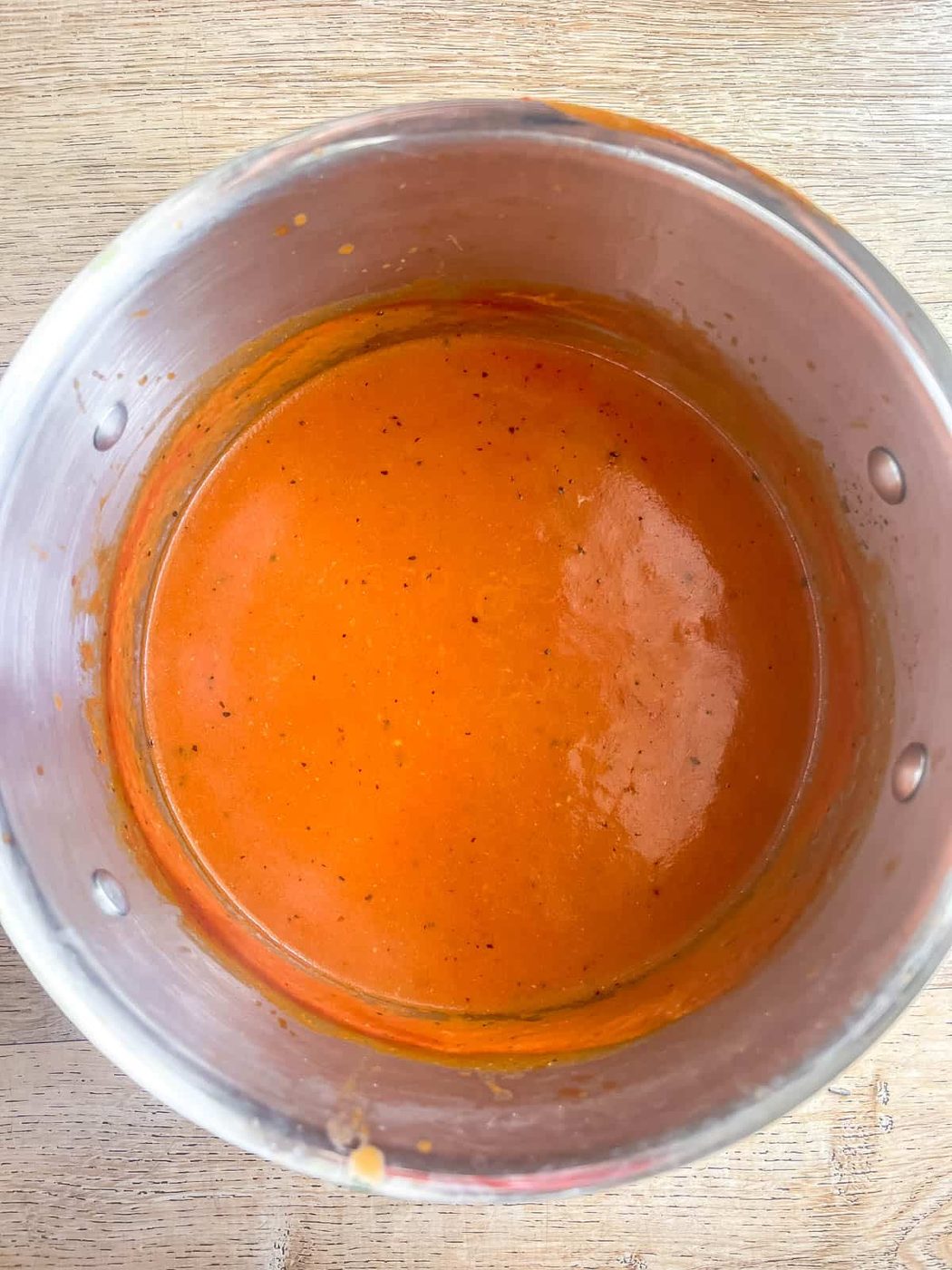 Fast tomato soup cooking in a pan.