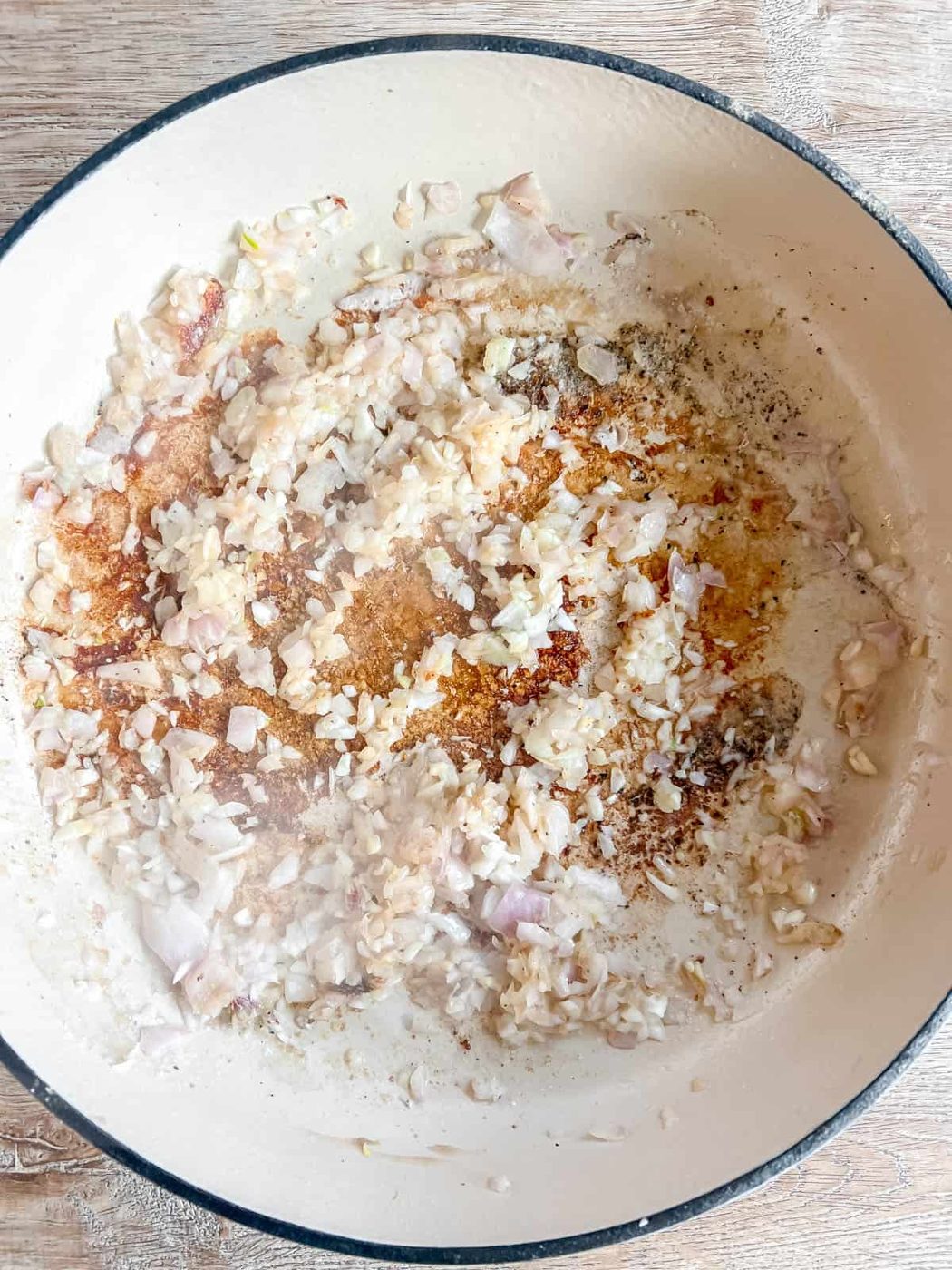Shallots and garlic in a dutch oven.