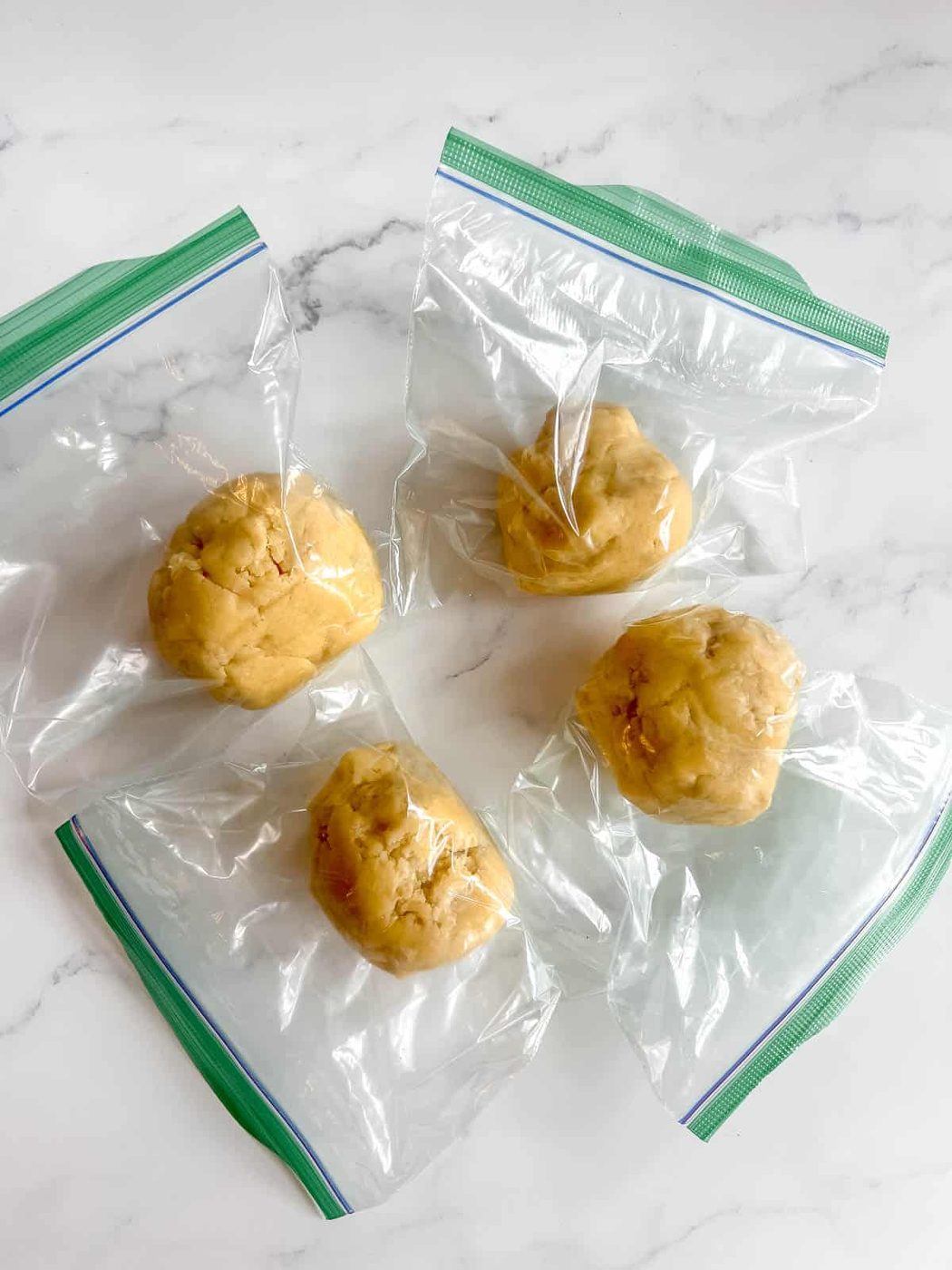 Cut Out Sugar Cookie dough going into the fridge.