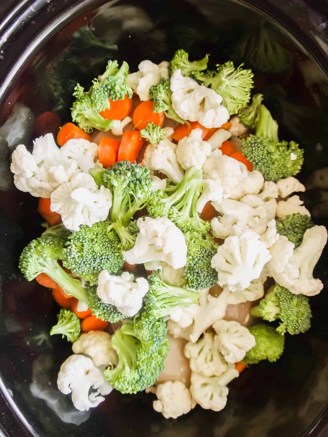 Veggies added to slow cooker.
