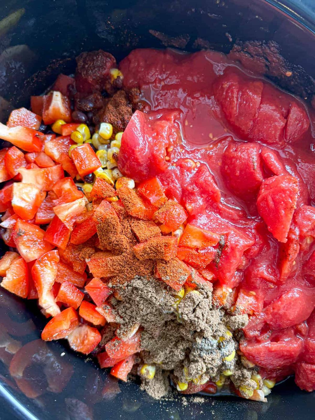 Ingredients for slow cooker turkey chili in a slow cooker.