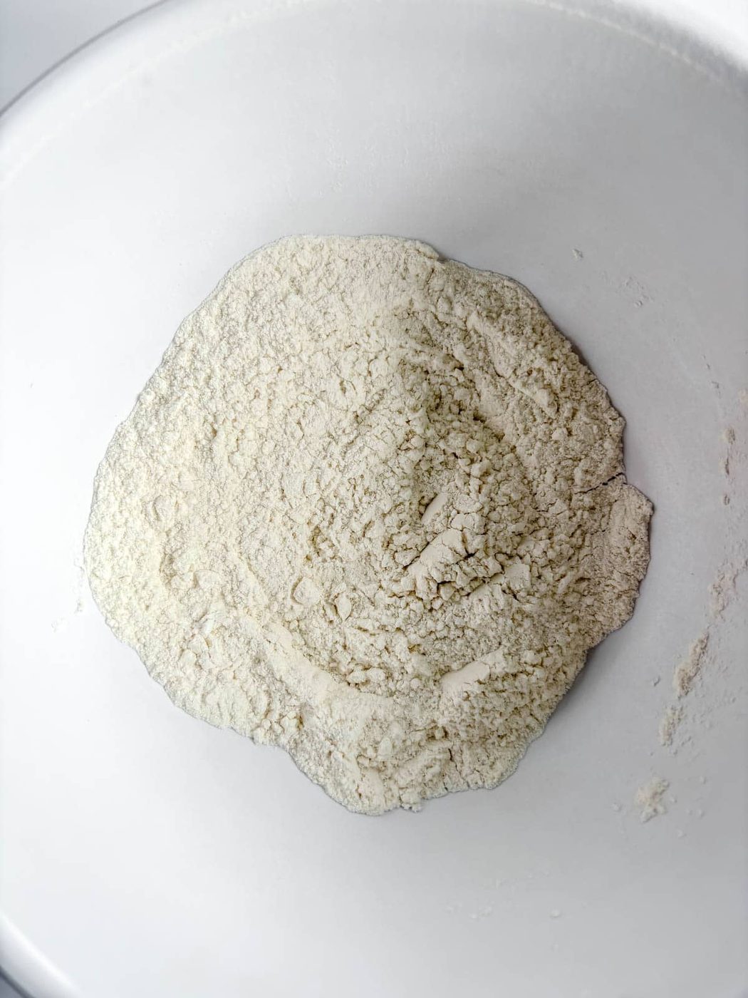 Dry ingredients in a bowl to make funfetti cupcakes.