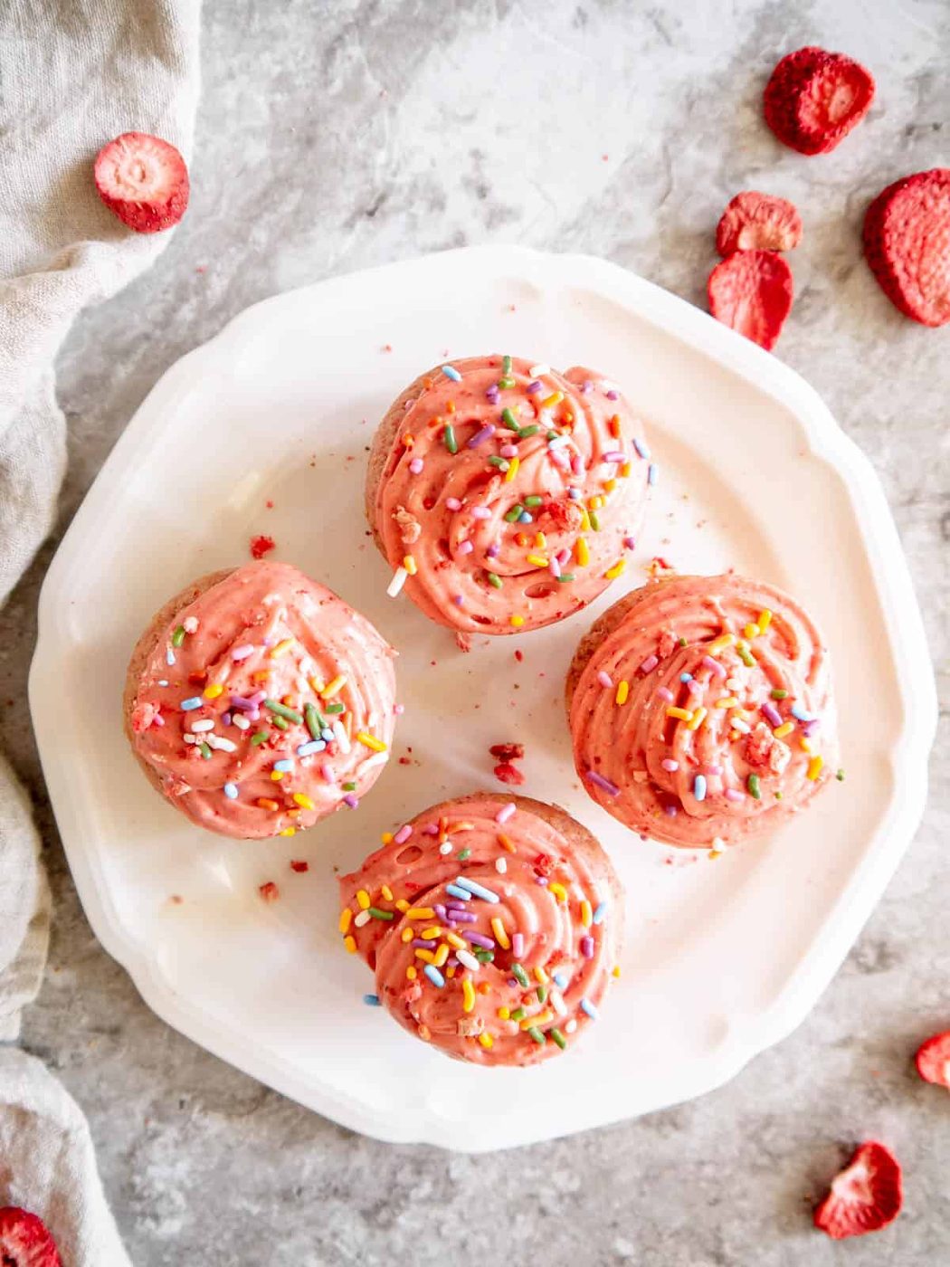 Strawberry cupcakes on a plate.