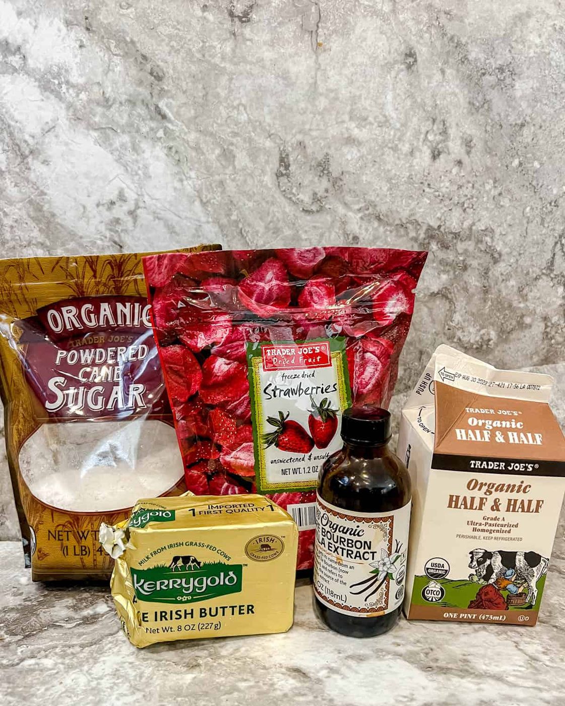 Ingredients needed to make strawberry frosting.