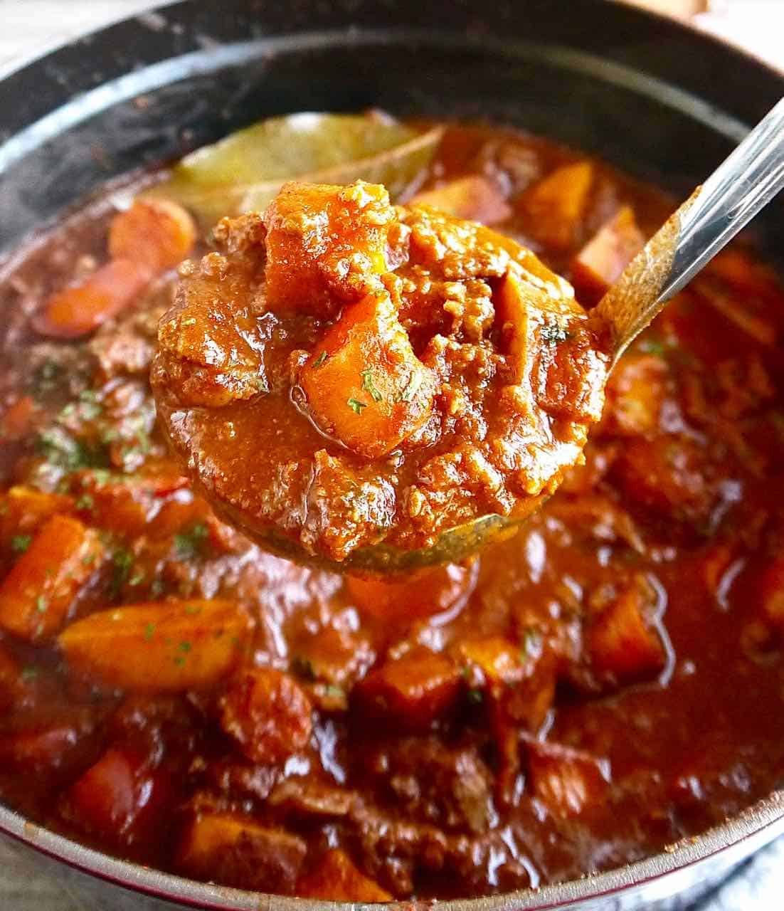 Coffee spiced chili recipe in a ladle.