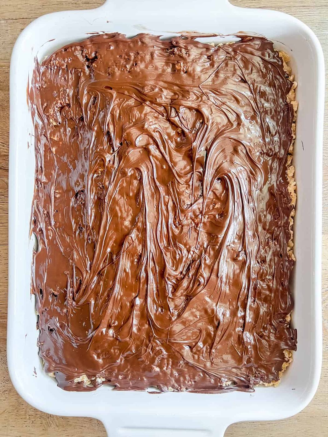 Melted chocolate added to rice krispie treats.