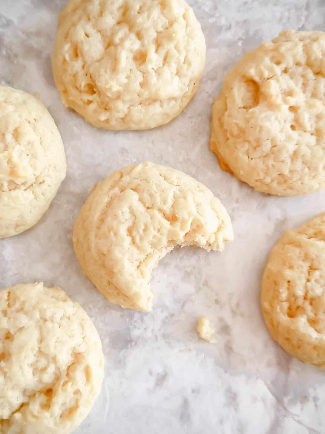 Olive Oil Sugar Cookie with a bite taken out of it.