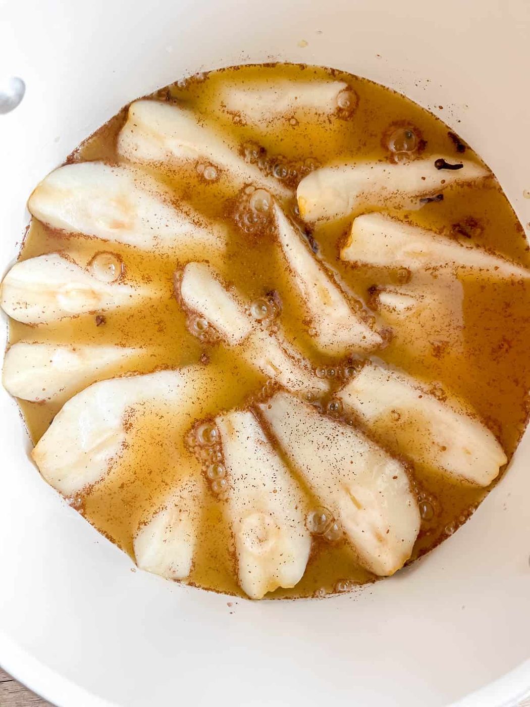 Orange juice poured on top of pears.