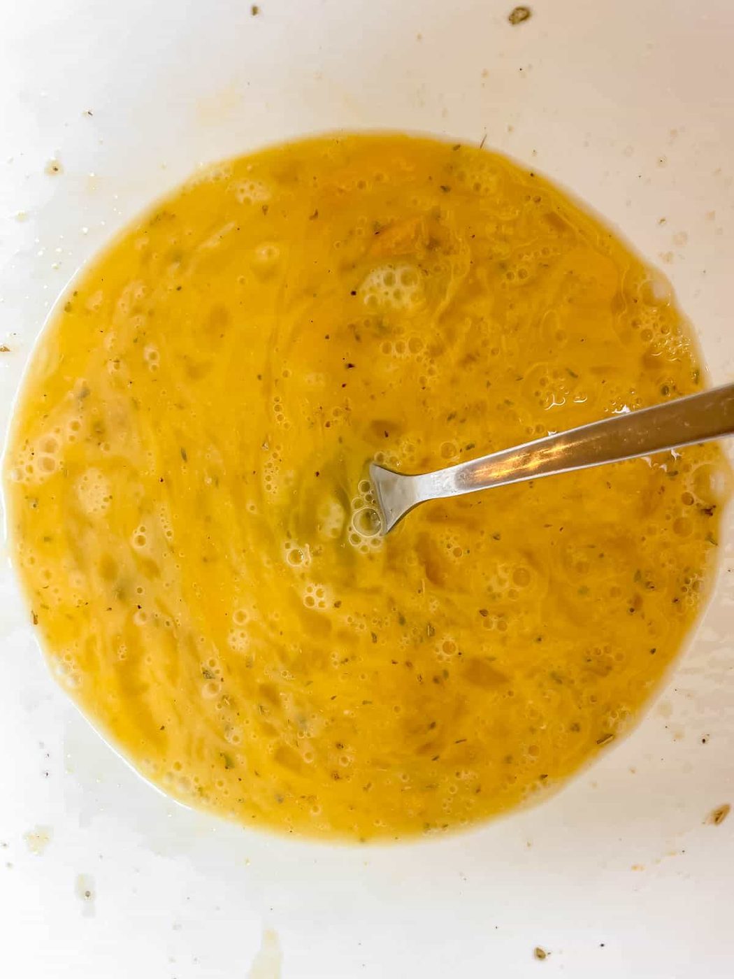 Eggs mixed together in a bowl.