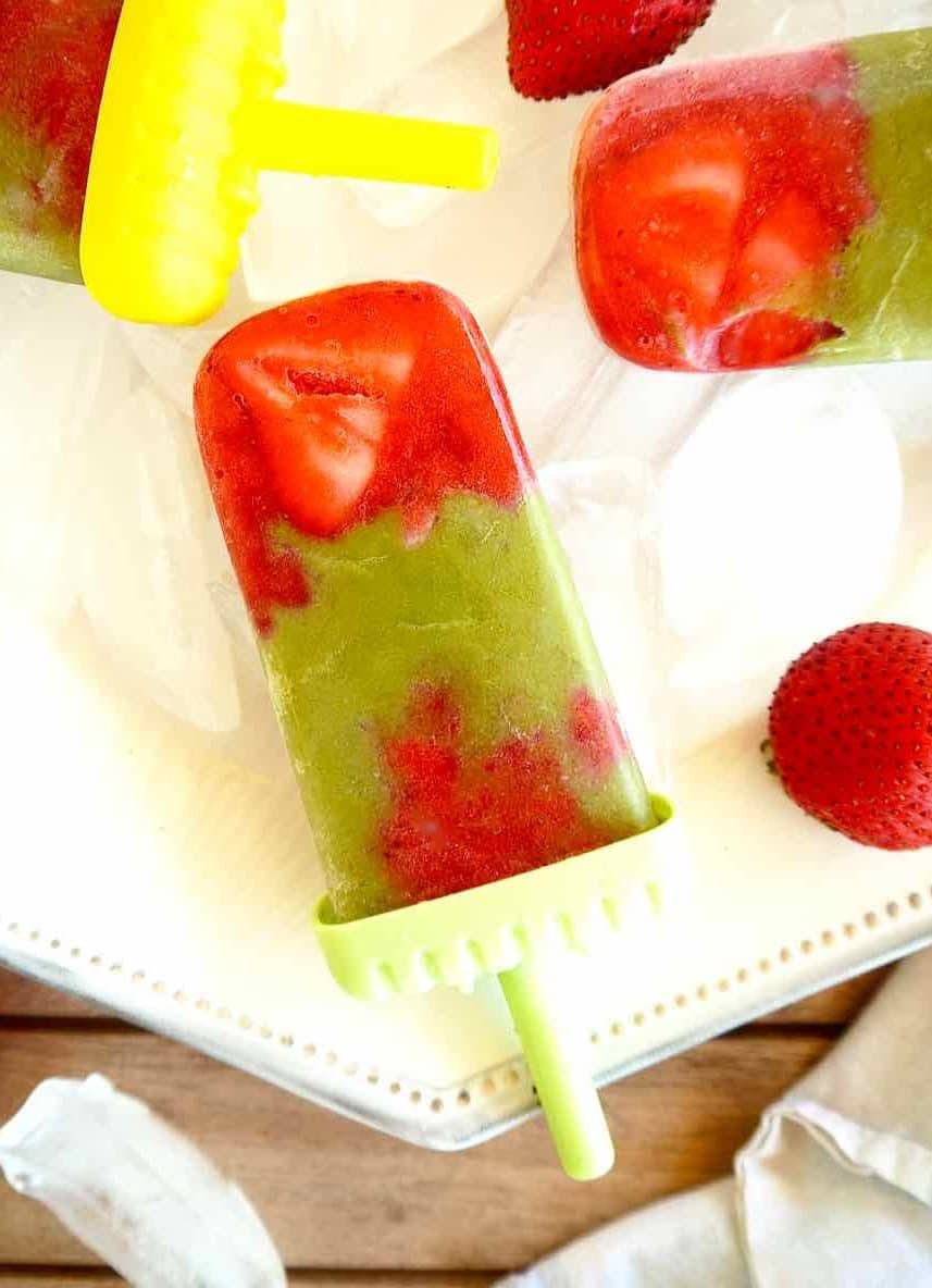 Strawberry Matcha Popsicles on a plate.