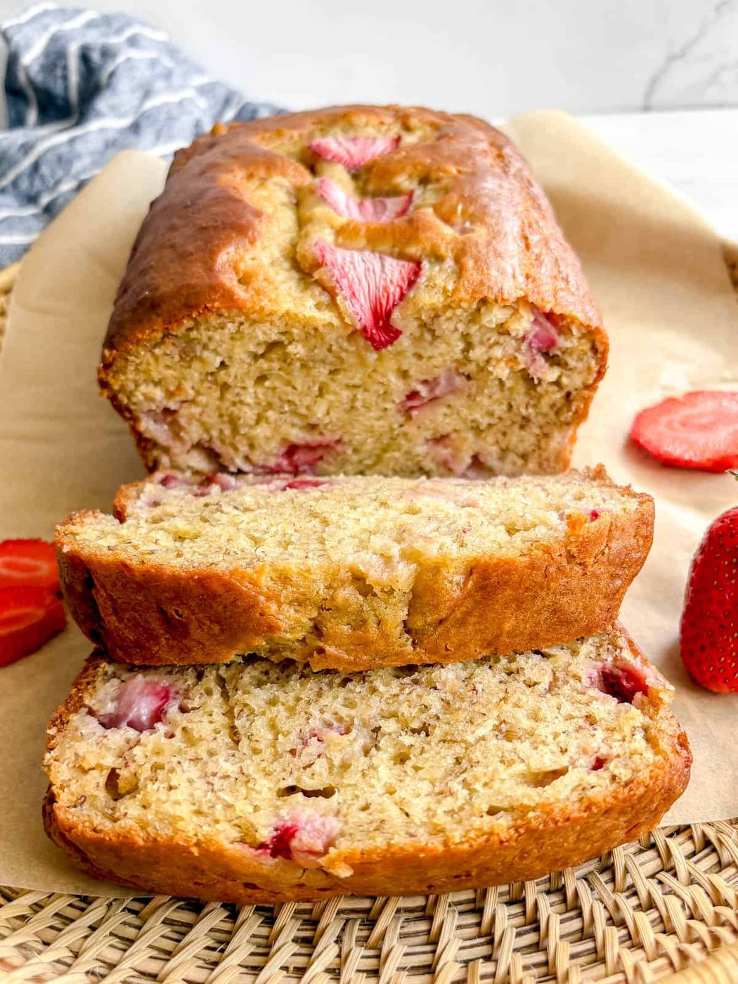 A few slices of strawberry banana loaf on a plate.
