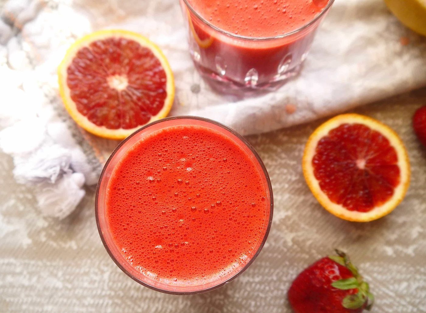 Aerial view of beet and carrot juice in a glass.