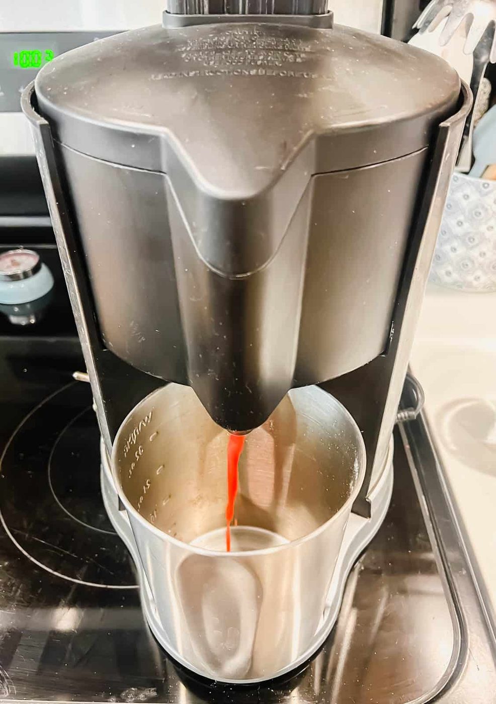 Juicing a strawberries to make strawberry juice.