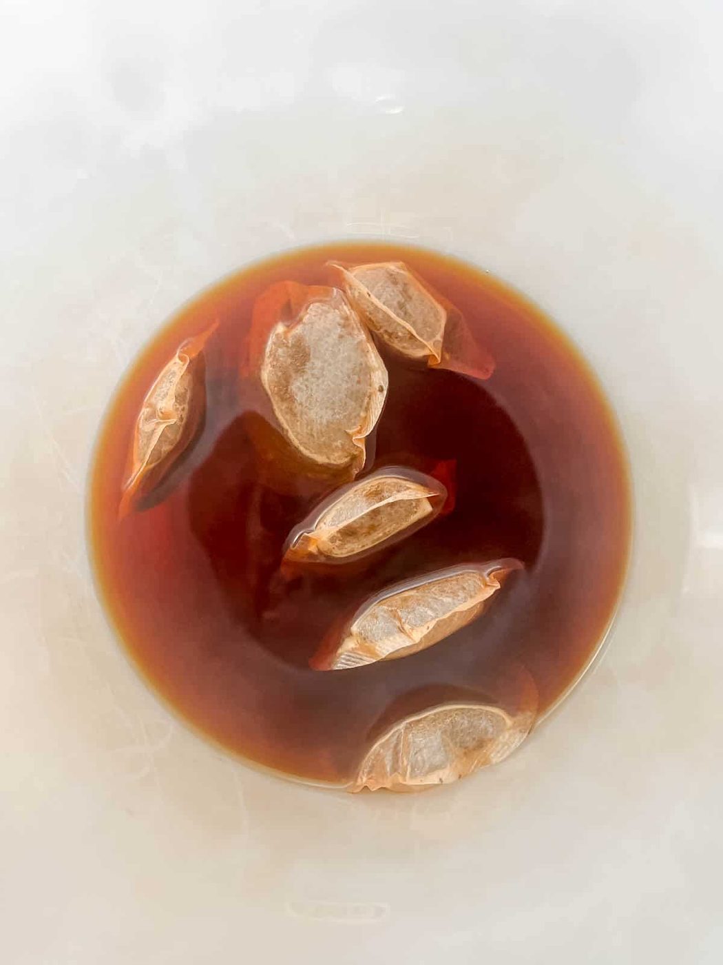 Steeping tea bags.