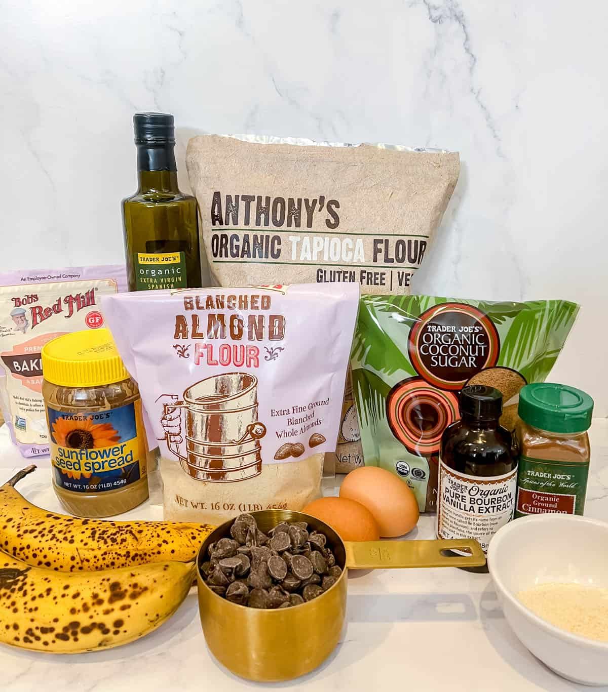 Ingredients needed to make paleo chocolate chip banana bread with sunflower butter.
