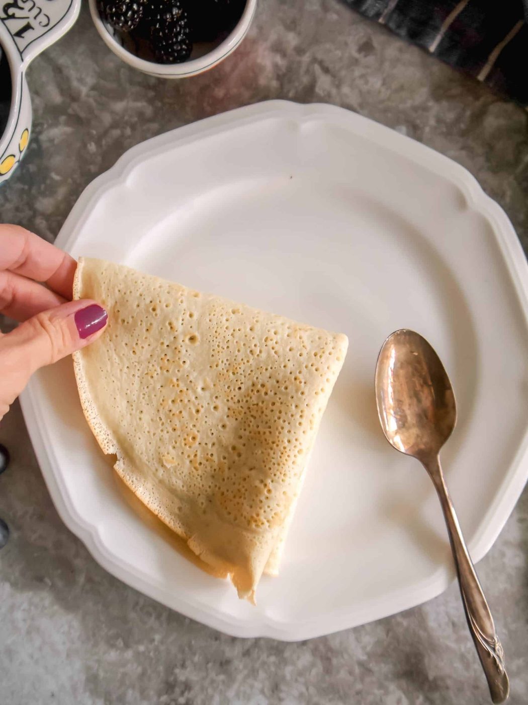 A sugar filled crepe folded into fours.