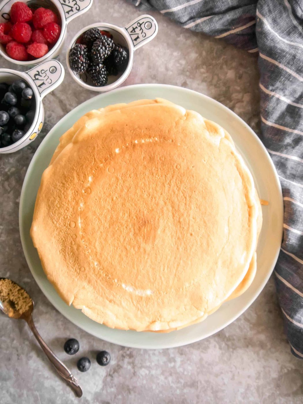 A stack of almond milk crepes on a plate.