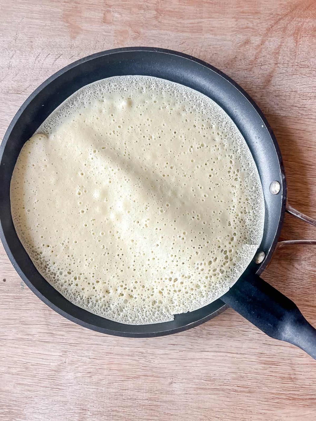 Getting ready to flip the crepe.
