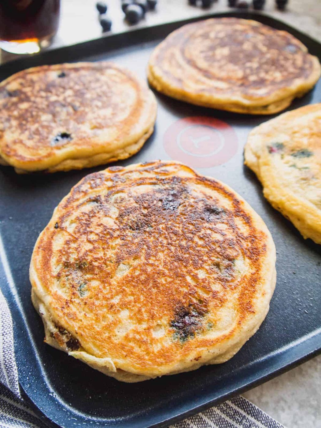 Freshly made paleo pancakes on a griddle.