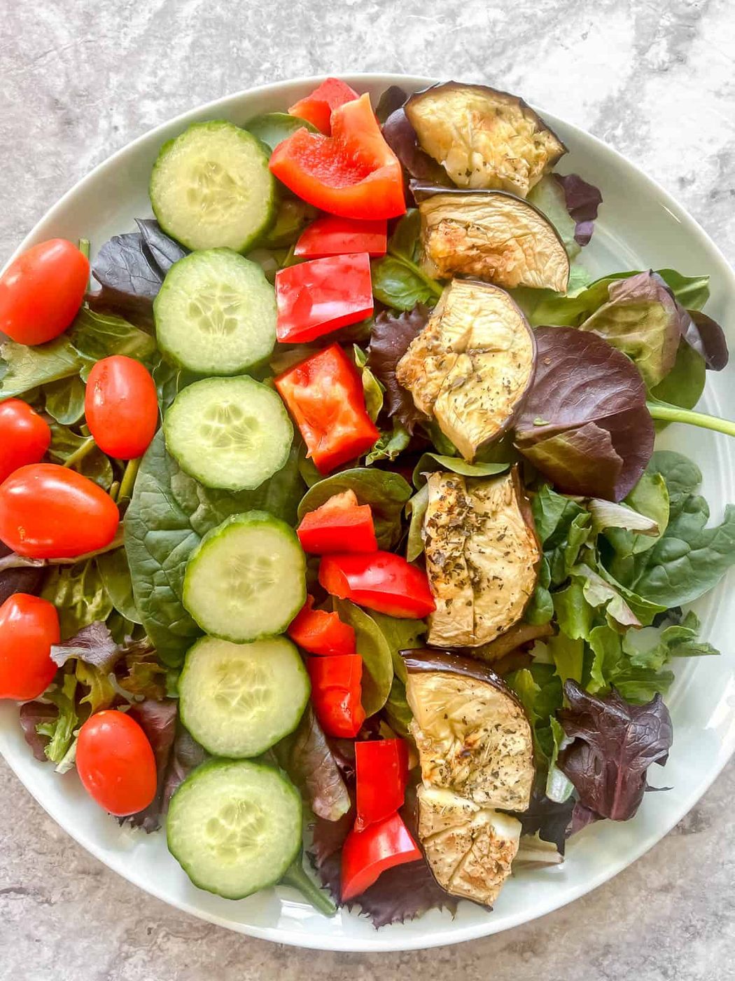 Tomatoes and eggplant added to the salad.