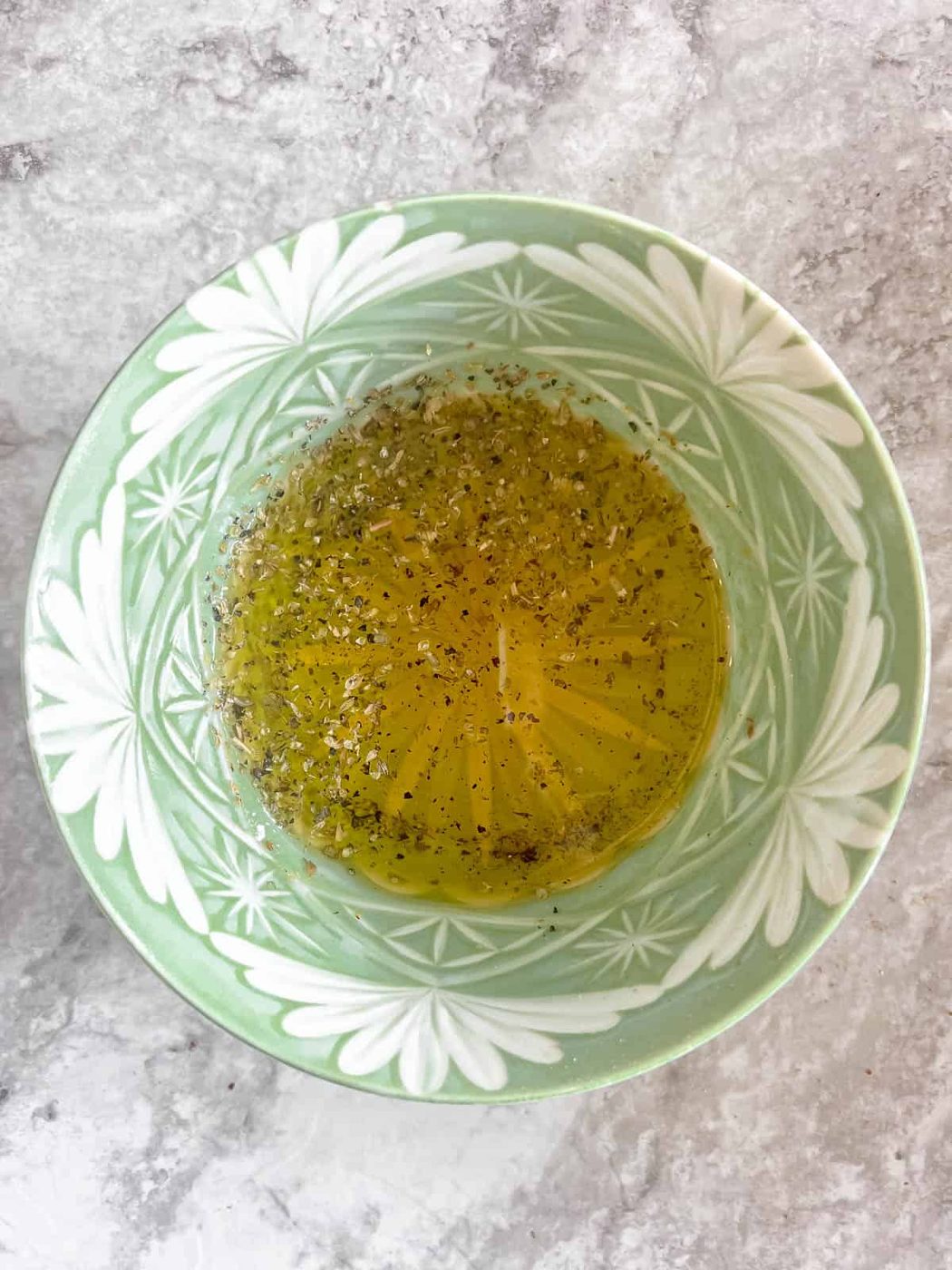 From-scratch oregano dressing in a bowl.