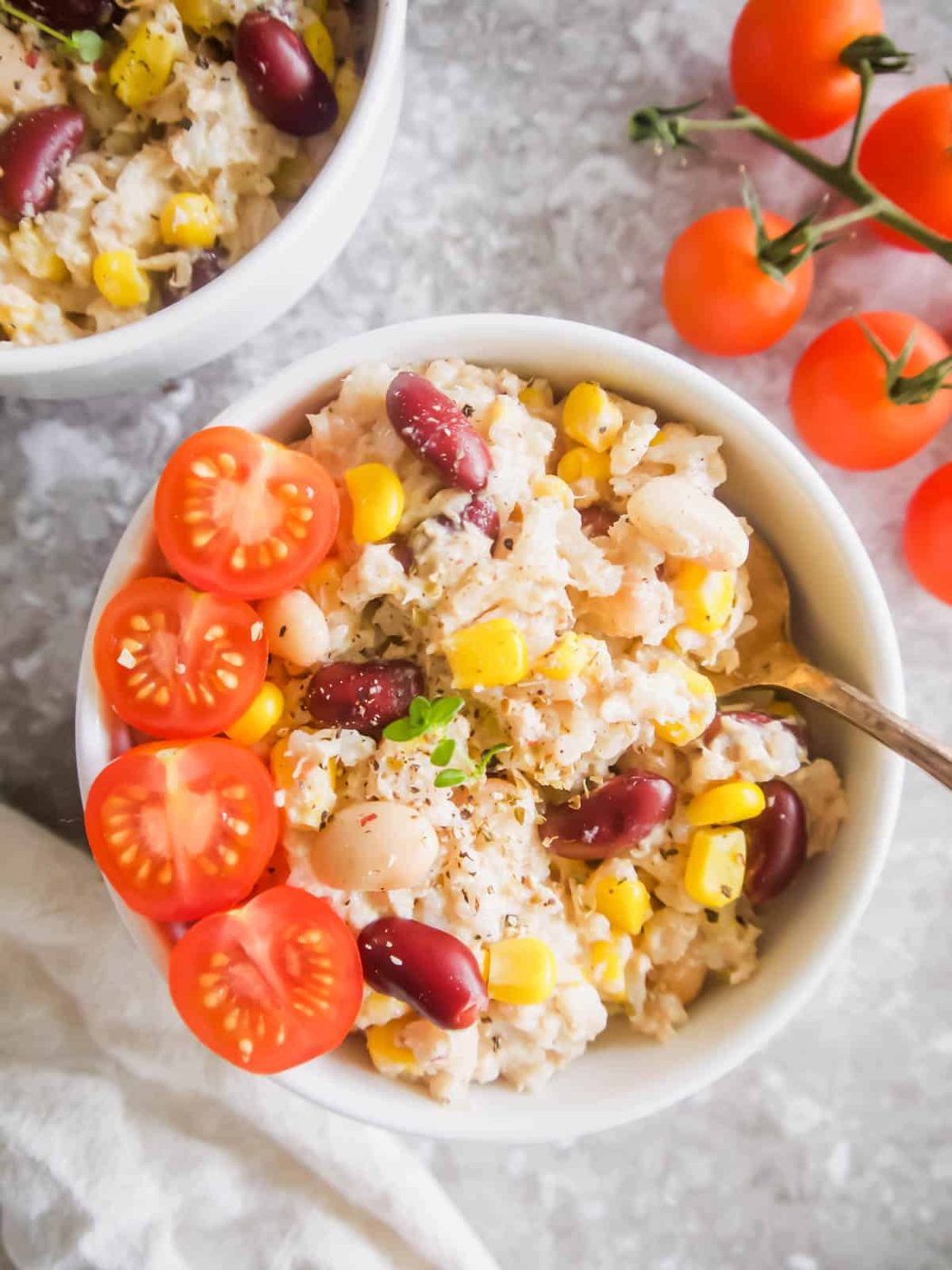 Big bowl of Tuna and Rice Salad with Corn and Beans with spoon in bowl.