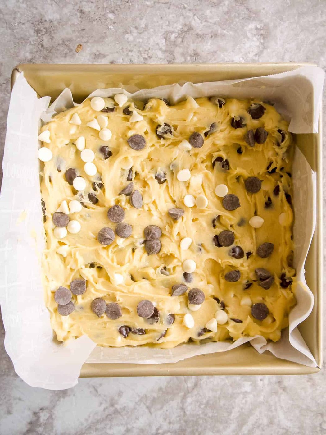 White chocolate brownie batter in a pan prior to baking.