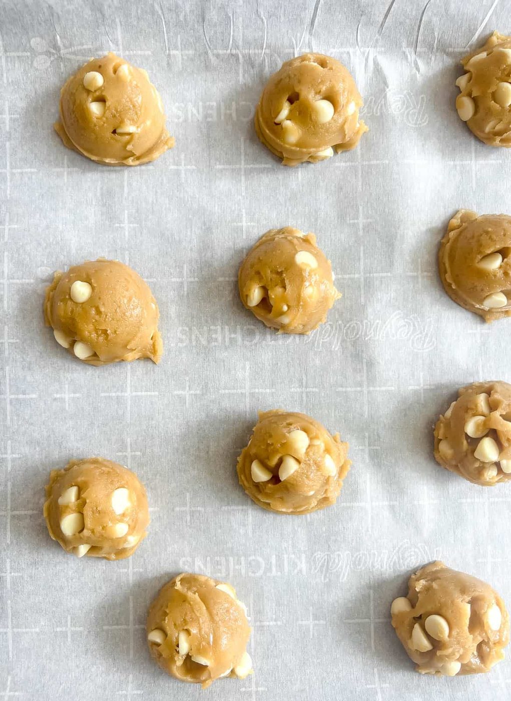 Cookies with white chocolate chips before baking.