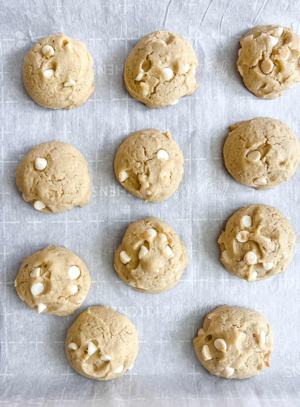 Cookies with white chocolate chips after baking.