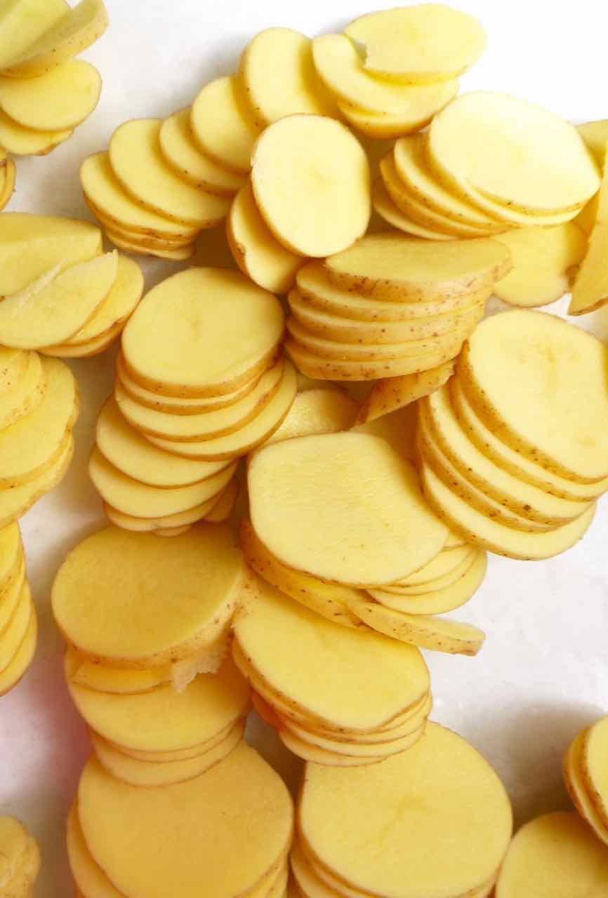 Sliced potatoes for recipe prep.