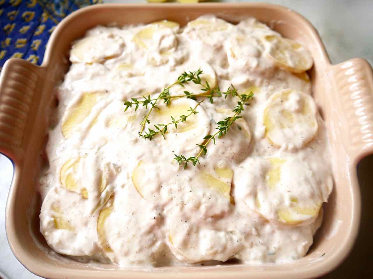 Layers of raw potato and béchamel sauce.