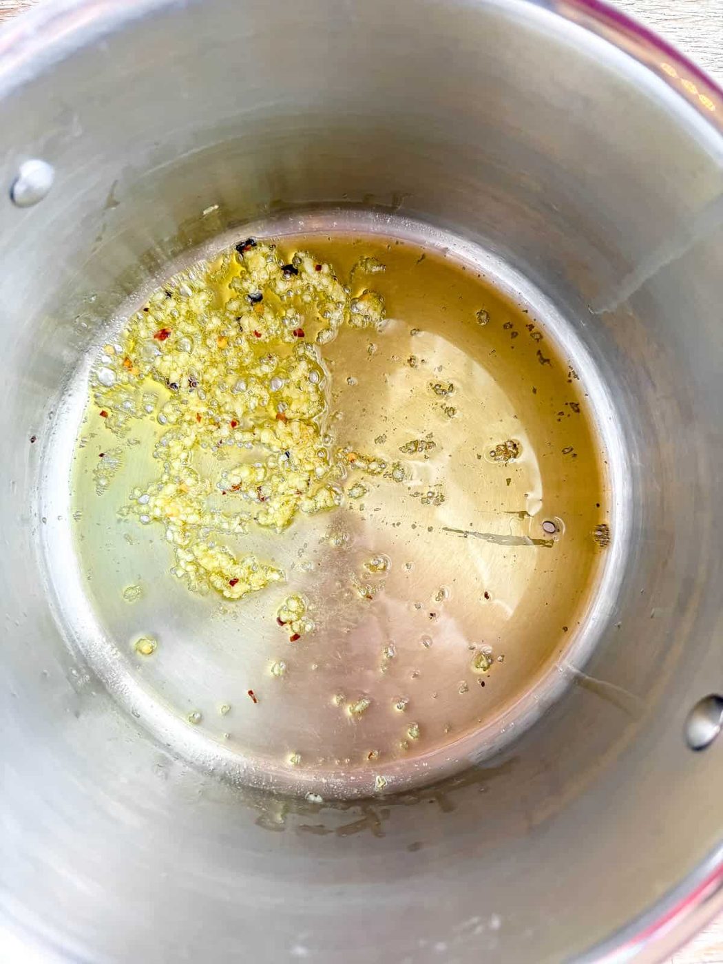Garlic sautéing in a pan.