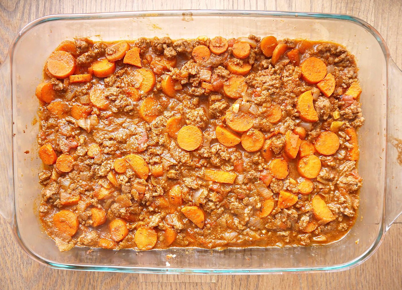 Carrot and beef gravy in a pan.