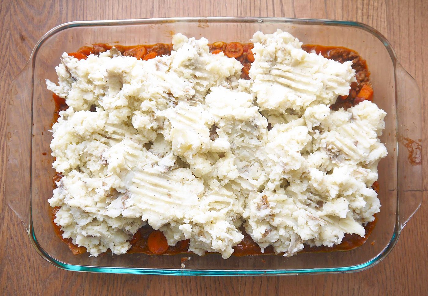 Adding cauliflower and potato mash to the beef gravy.