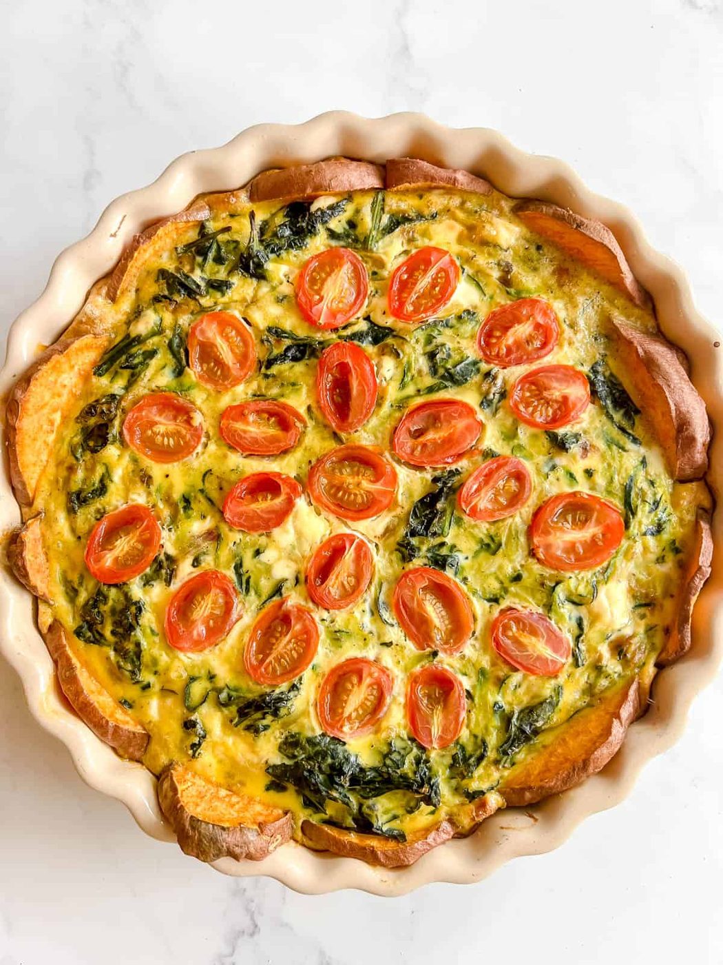 Zucchini and kale quiche with a sweet potato crust after baking.