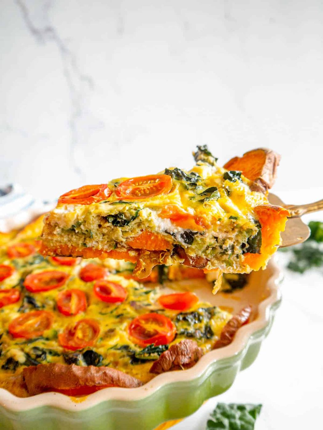 A slice of sweet potato and zucchini quiche.
