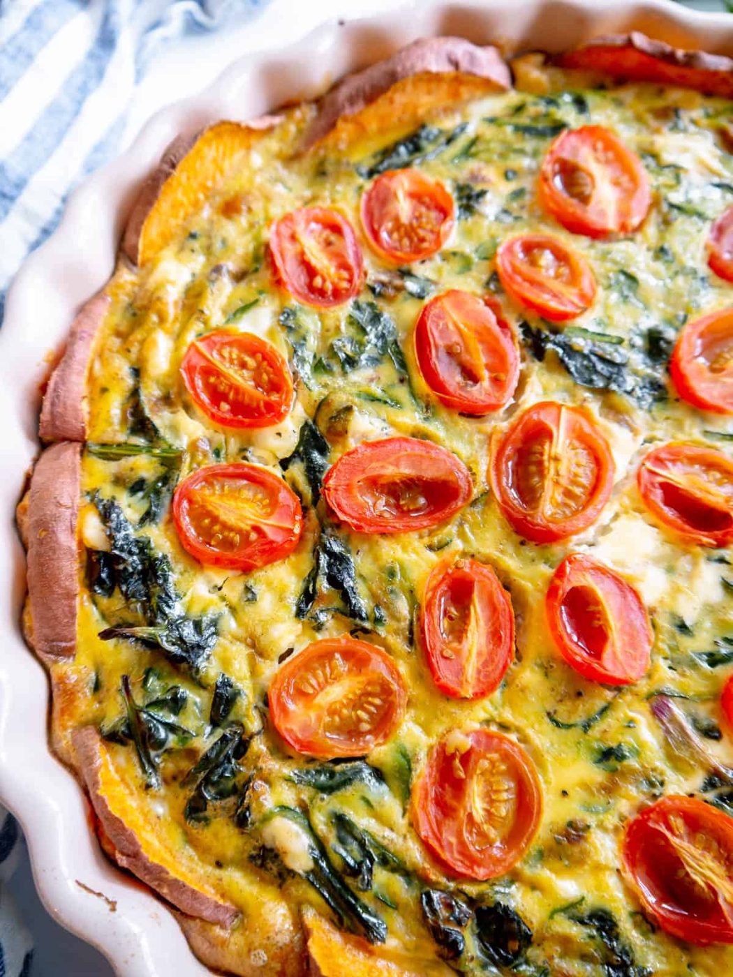 Quiche made with kale, zucchini, tomatoes and sweet potatoes.
